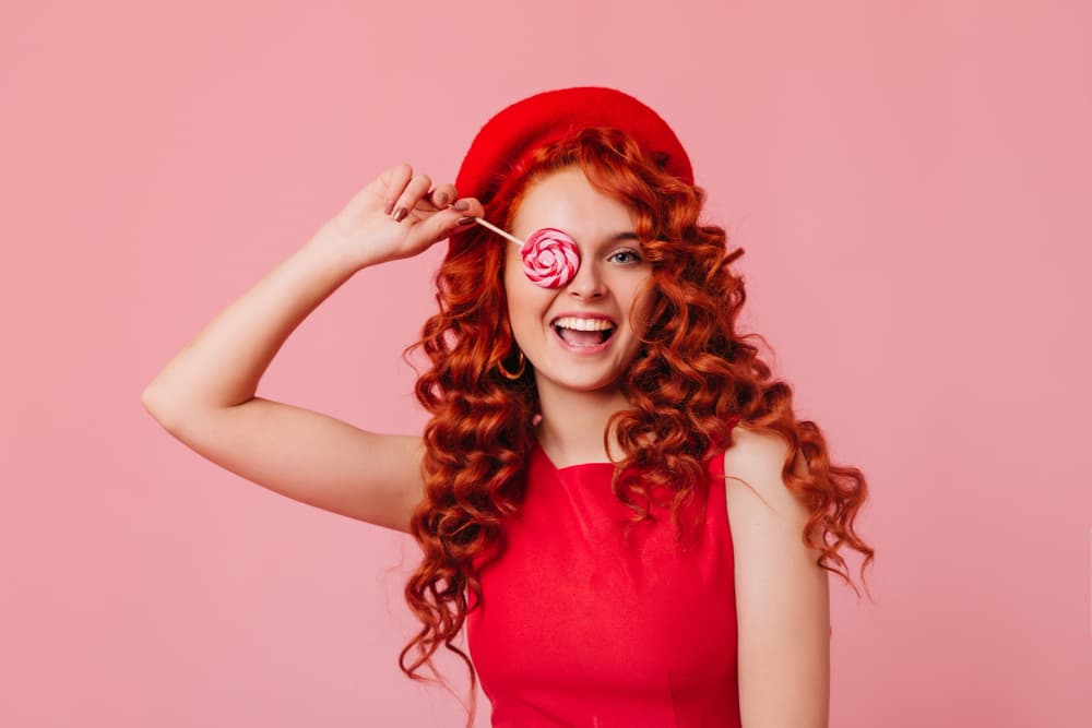 girl has red colour curly hair