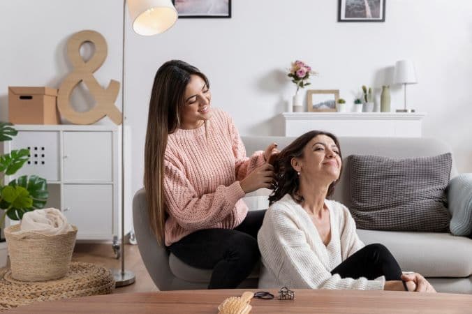 Daughter caring for her mother's hair